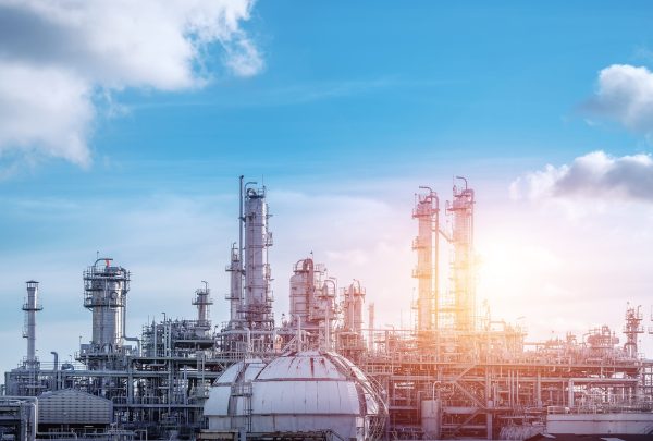 Manufacturing of petrochemical industrial or Oil and gas refinery plant with sunset sky