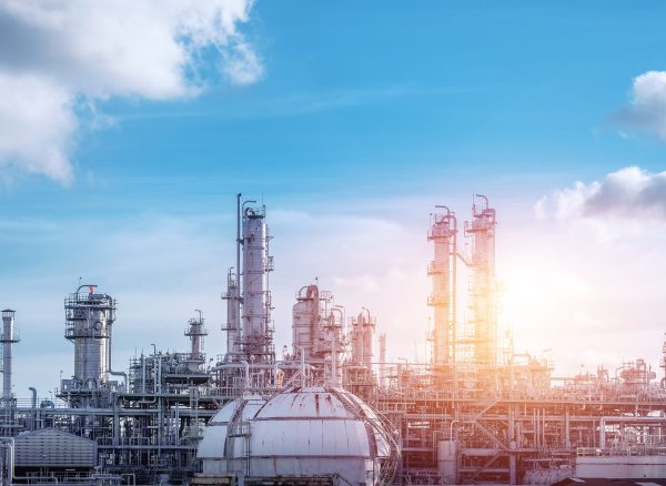 Manufacturing of petrochemical industrial or Oil and gas refinery plant with sunset sky